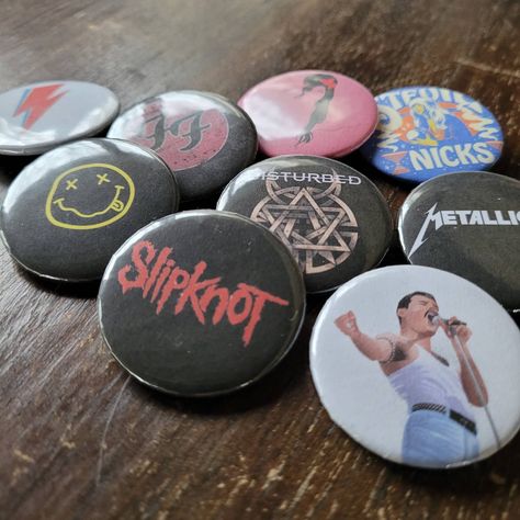 These handmade 1.5" pinback buttons are the perfect accessory to add to your outfit or give as a gift! These pins are made with metal pins and are approximately 1.5" across. They are not waterproof.  Due to the small size of the label, keeping your saying to 5 words or less will typically fit better on the 1.5" circle. Shipping: The shipping is $3.50, because that is the cheapest option to ship and still get tracking. Everything on this listing will ship with a First Class Label With Tracking, u Band Pins Buttons, Grunge Pins, Band Pins, Button Pins Aesthetic, Pin Ideas Button, Pin Button Design, Rock Jeans, Rock N Roll Party, Grunge Music