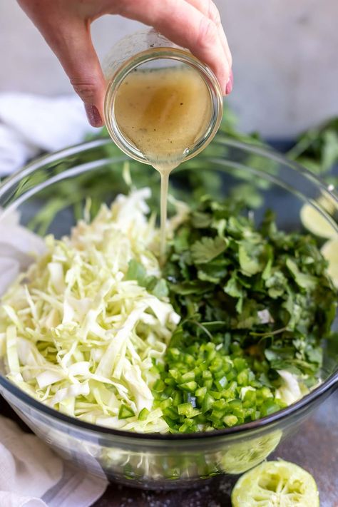 Cilantro Lime Slaw is a great summertime side dish or taco topping. Make this No Mayo Coleslaw with a few simple ingredients to serve at your next dinner or barbecue. #coleslawrecipe #cilantrolime #slaw #cilantrolimeslaw #sidedishrecipes Lime Coleslaw Recipe, Slaw For Tacos, No Mayo Coleslaw, Mexican Slaw, Taco Side Dishes, Lime Slaw, Cilantro Lime Slaw, Slaw Recipes, Cabbage Slaw