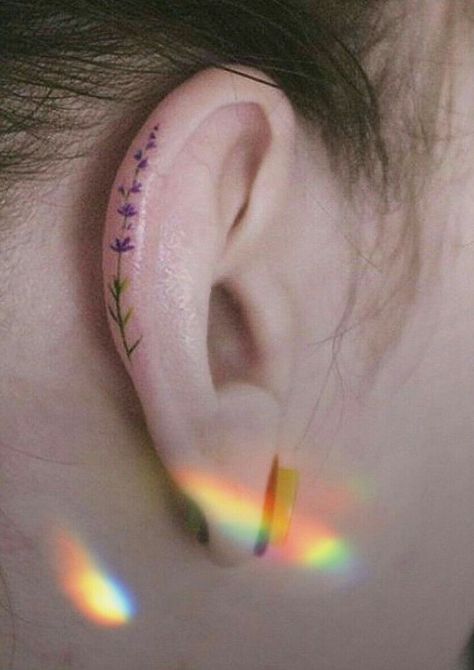 Mini Ear Tattoos, Ear Tattoo Colorful, Dainty Ear Tattoos For Women, Lavender Ear Tattoo, Pride Ear Tattoo, Color Ear Tattoo, Ear Tattoo Aesthetic, Colorful Ear Tattoo, White Ear Tattoo