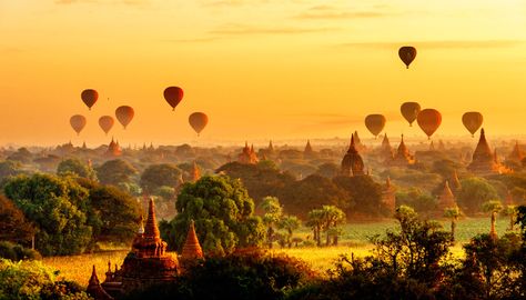 Hot air balloons float above an orange sky as the silhouettes of thousands of temples provide a perfect backdrop. The balloons are used in Bagan, Myanmar, to give tourists take a sky-high view of the beautiful landscape. Bagan Sunrise, Bagan Temples, Myanmar Travel, Strange Events, Panoramic Photography, Beautiful Landscape Photography, Anime Cover Photo, Orange Sky, Weird News