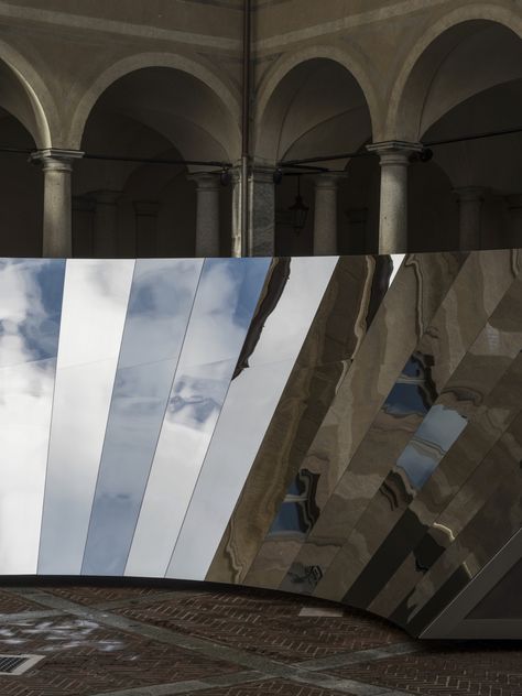 COS and Phillip K. Smith III Unfolds the Milanese Sky in a Reflective Mirror Installation - Design Milk Reflective Installation, 16th Century Architecture, Wall Of Mirrors, Italian Palazzo, Faceted Mirror, Mirror Installation, Italian Architecture, Industrial Architecture, Interactive Installation