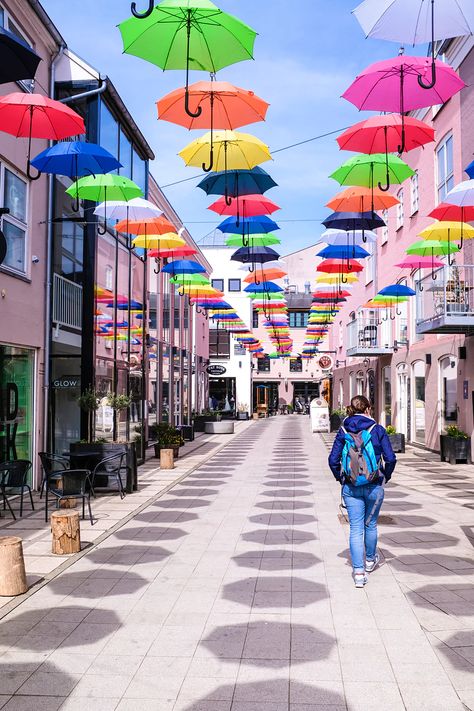 Brightly coloured umbrellas in Vejle, Denmark Umbrella Street, Copenhagen Travel, Denmark Travel, Pedestrian Street, Quirky Art, Pedestrian Bridge, Floating In Water, Aarhus, Old Building