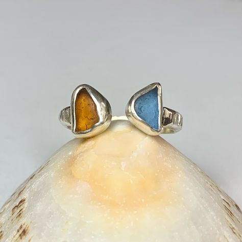 ~ Double Sea-glass Ring 🧡💙 ~ These are available to order through DM £65 Or through Etsy £75 ~ These rings are adjustable but can be made to your exact size if you know it ~ Choose two colours to design your ring, or I can use your own sea-glass 🩵 ~ Pictures are all of the same ring just in different light! #seaglassmagic Sea Glass Ring, Glass Ring, Glass Pictures, Glass Rings, You Know It, Different Light, Sea Glass, I Can, Ring