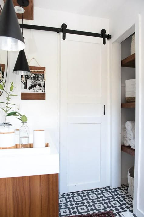 A Small Bathroom Door Is the Designer Trick You've Probably Never Considered, But Should Small Corner Bath, Small Bathroom Door Ideas, Small Bathroom Door, Bathroom Door Ideas, Modern Sliding Barn Door, Diy Sliding Barn Door, Small Doors, Small Bath, Chic Bathrooms