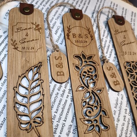 These bookmarks make a memorable gift for your party guests and a unique way to remember your special day. Impress your guests with bookmark favorites. You can gift a bookmark Gifts for your guests such as wedding favors, party favors, birthday gifts These bookmarks are laser engraved on bamboo wood. They have a deep, clear engraving that provides great contrast. The paper bookmark holder will come separately from the bookmark upon shipment to ensure that they reach the buyer's hands in intact c Wood Bookmarks Cricut, Laser Burning Ideas, Wood Engraving Ideas, Wood Wedding Favors, Bookmark Favors, Engraved Bookmark, Bookmark Holder, Wooden Bookmarks, Wood Laser Ideas