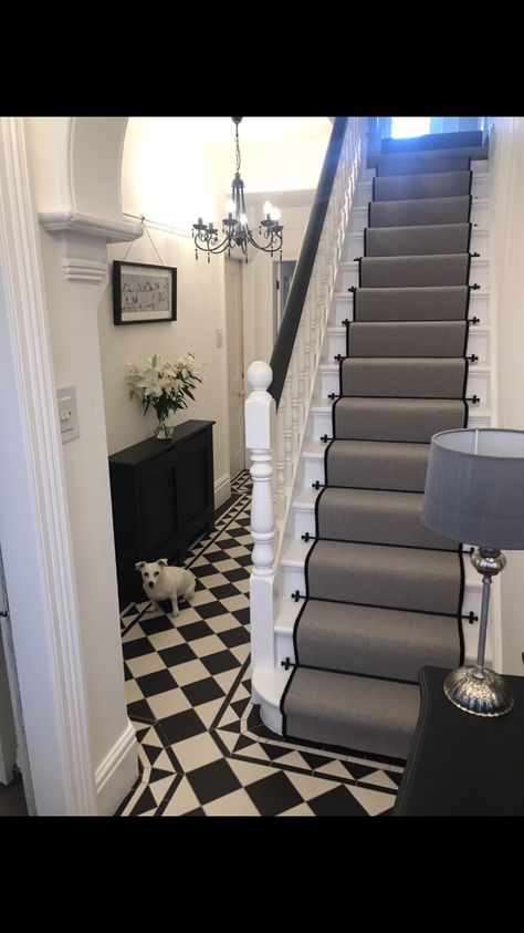 Makeover for our hallway. Had Victorian black and white tiles fitted. Used farrow and ball off black on paint work. Finished off with a grey runner edged in black with black stair rods. Grey Stair Runner With Rods, Stair Runner Victorian Tiles, Stair Carpet With Rods, Carpet Rods Stairs, Black White Tiles Hallway, Black And White Tile Entrance, Black Stair Rods Carpet Runner, Grey And Black Stair Runner, Victorian Staircase Runner