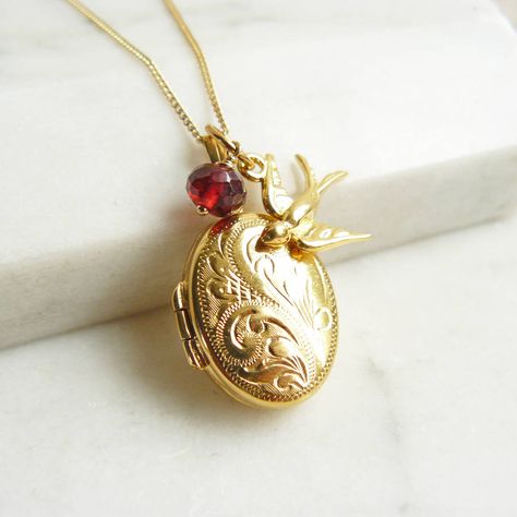 A beautiful engraved rolled gold locket necklace with a swallow charm and the option of adding a birthstone.Lockets are for those special, personal occasions which punctuate our lives, whether it is a new baby, a new marriage or one that has stood the test of time, or to remember a loved one. The swallow is often used to express strength, spirituality, aspiration and constancy with hope for the future - after all the swallows always return in the spring. A locket is a lifetime present, that is the ultimate personal gift. The necklace comes boxed and can be giftwrapped. At Lime Tree Design we take pride in working with small workshops in the world renowned Birmingham Jewellery Quarter where our lockets are made by hand. Lockets are hallmarked in Birmingham.The chain, swallow and fittings ar Kurta Ideas, Engraved Locket, Gold Locket Necklace, Picture Locket, Lime Tree, Oval Locket, Turquoise Jewelry Native American, Aesthetic Jewelry, Jewelry Lockets