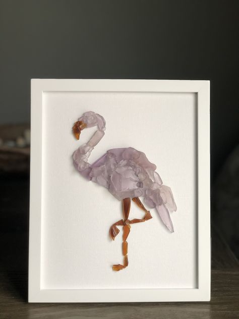 flamingo silhouette with pink seaglass #seaglass #seaglassart #seaglassartist #seaglasssilhouette #seaglassoncanvas #maineseaglass #mainecoast #mainefound #maine #handpicked #coastaldecor #flamingo Flamingo Sea Glass Art, Sea Glass Flamingo, Seaglass Diy, Seaglass Art Ideas, Flamingo Silhouette, Sea Glass Window Art, Beach Resin Art, Sea Glass Window, Broken Glass Crafts