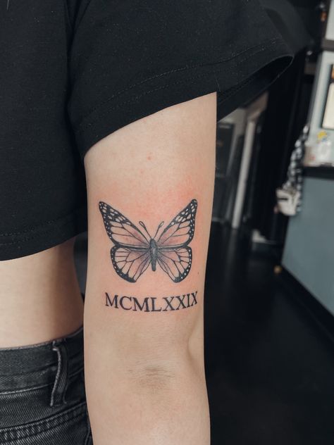 Roman Numeral And Butterfly Tattoo, 1998 Tattoo Above Knee, Butterfly Roman Numeral Tattoo, Butterfly Tattoo With Roman Numerals, Butterfly With Date Tattoo, Roman Numeral Tattoo With Butterfly, Butterfly Tattoo With Date, Tattoo With Roman Numerals, Butterfly Tattoo With Name