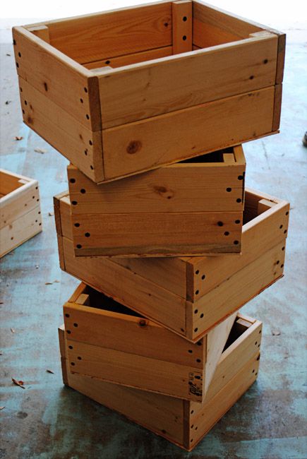 DIY Crate Tutorial {simple, cheap & easy}...this would be a cheaper way to get all the organized storage I love without the big cost of buying real crates OR baskets. LOVE the handles she put on the front...great addition!!