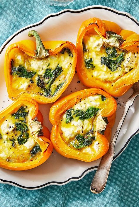 This healthy stuffed peppers recipe gets a breakfast twist when you bake eggs, spinach and feta directly in the pepper for a stunning dish. #healthyeating #healthyfoods #healthylifestyle #healthyrecipes #vegetarian#vegetarianrecipes#vegetarianideas#vegetariancooking Bfast Casseroles, Pepper Recipes Healthy, Vegetable Ideas, Baked Spinach, Breakfast Favorites, Eggs In Peppers, Spinach Feta, Dessert Smoothie, Lunch Appetizers