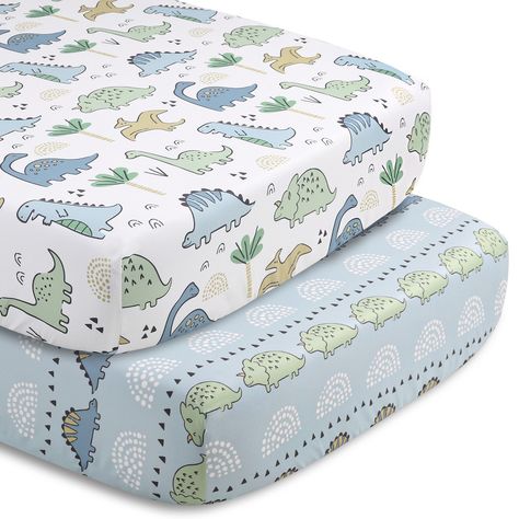 Bring the adventure indoors with this 5-piece Blue Dino baby bedding set from The Peanutshell. Our generously sized 32" x 41" soft and cozy quilt features three blue and green dinosaur friends with geometric landscape details. The character tossed fitted crib sheet comes in a perfect universal fit, designed for a standard 28" x 52" crib mattress with snug fitting all around elastic. A second fitted sheet print features a linear parade of stegosaurus and triceratops on a light blue background. Ou Dinosaur Boy Nursery, Dinosaur Nursery Baby Boy, Dinosaur Crib Sheets, Dinosaur Baby Room, Dinosaur Nursery Theme, Dino Room, Dinosaur Patterns, Landscape Details, Dinosaur Bedding