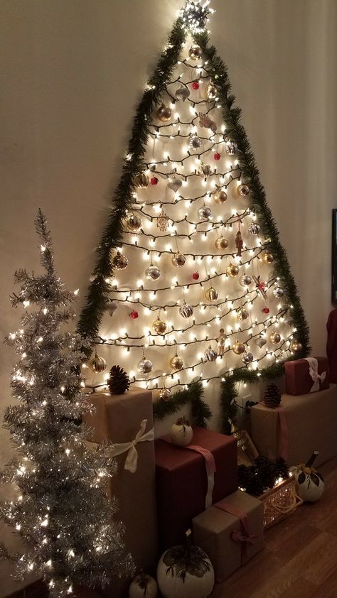 Christmas wall Tree Wall Tree Christmas Diy, Xmas Tree On Wall With Lights, Christmas Tree Ideas On The Wall, Wall Light Christmas Tree, Light Christmas Tree On Wall, Christmas Tree On Wall With Lights, Christmas Wall Tree Ideas, Garland Tree On Wall, Christmas Light Tree On Wall