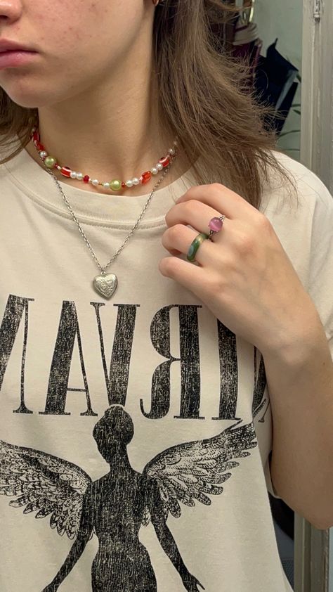 Nirvana T-shirt, beaded necklace, colourful rings Nirvana T Shirt Outfit, Nirvana Necklace, Nirvana Shirt Outfit, Nirvana Outfit, Hannah Core, Colourful Rings, Summer Picture Ideas, Nirvana T Shirt, Nirvana Tshirt