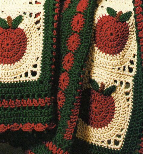 "Fill up that bushel basket--a lovely 1980s country apple crochet blanket pattern. The scalloped edging adds a sweet, old-fashioned touch to this harvest wrap. Granny square motif blocks are 7 1/4\" inch with a finished size afghan of 48\" x 60\" inches. The yarn pictured: worsted weight yarn green 850 yards, red 790 yards, tan 620 yards, a small amount of brown, crochet hook size H. Worked up in treble crochet. Darling home decor. For more cute crochet patterns, check out here: https://www.etsy No Sew Crochet Blanket, Hand Crochet Blanket Patterns, Vintage Fall Crafts, Apple Granny Square Pattern, Crochet Blanket Fall, Crochet Patterns Autumn, Cottagecore Granny Squares, Fall Crochet Decorations, Harvest Diy Decor