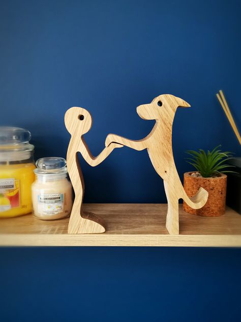 This beautiful wooden statue emphasises the love between man and dog, and would make a lovely gift to those with a four-legged friend to showcase the bond they have! It makes for a lovely centre piece on a mantle and will be a talking point for your guests. Made of solid oak, this sturdy piece will make a great addition to your home. Please note, colour, weight and dimensions may vary due to timber supply. Tall Dog, Wood Log Crafts, Tallest Dog, Wooden Man, Scroll Saw Patterns Free, Small Woodworking Projects, Wooden Statues, Wood Logs, Man And Dog