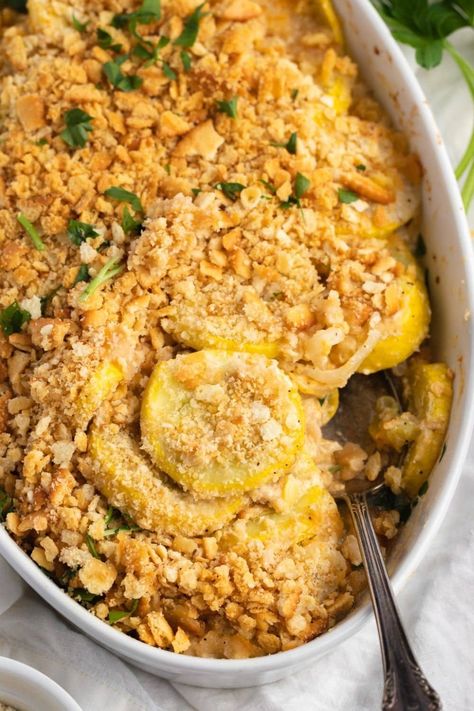 You can't go wrong by making Paula Deen's squash casserole! This cheesy dish with a cracker topping is a side dish that immediately wins people over. Squash Casserole Paula Deen, Paula Deen Squash Casserole, Best Squash Casserole Recipe, What To Serve With Fish, Christmas Casserole Recipes, Sides For Fish, Squash Dishes, Veggie Casseroles, Fried Squash