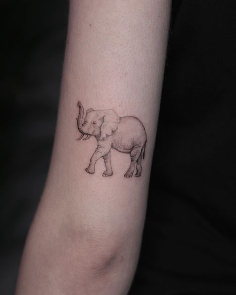 Elephant Tattoo Ideas And Elephant Tattoo Meaning | Elephant Tattoo Are You Thinking About Getting An Elephant Tattoo? Take A Look At These Inspired Designs For Fresh Ideas. Lifestyle Shaded Elephant Tattoo, Elephant Tattoos Trunk Up, Elephant Trunk Up Tattoo, Tattoo Ideas Female Elephant, Elephant Memorial Tattoo, Nanny Tattoo, Tattoo Pols, Simple Elephant Tattoo, Elephant Head Tattoo