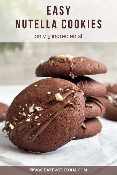 Satisfy your sweet tooth this fall and winter with these simple 3-ingredient Nutella cookies! This easy recipe requires just a few ingredients but is so delicious and so soft and chewy. Perfect for fall desserts, winter sweet treats, or as a quick and satisfying dessert for any occasion. Whether it’s for Thanksgiving, Christmas, or a dinner party, these Nutella cookies will be a hit. Visit bakewithzoha.com for the complete recipe! Nutella Holiday Recipes, Nutella Truffles 3 Ingredients, Cookies With Nutella Filling, Few Ingredient Dessert Recipes, Gluten Free Nutella Cookies, Easy Bake Cookies 3 Ingredients, Recipes With Nutella Easy, Easy Baking Recipes Desserts 3 Ingredients Simple, Nutella Cookies Recipe 3 Ingredients