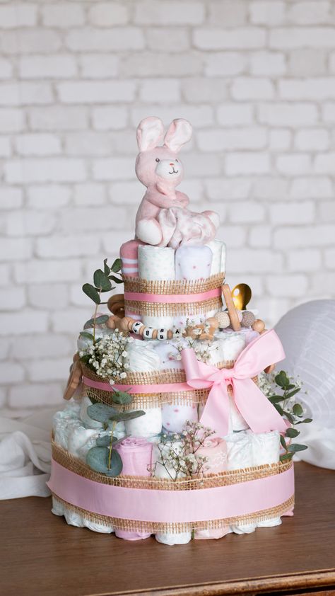 Easy Diaper Cake Ideas, How To Diaper Cake, Diaper Cake Baby Girl, Diaper Cake Ideas Girl, How To Make Diaper Cake, How To Make A Diaper Cake Step By Step, Baby Girl Diaper Cake Ideas, Baby In Bloom Diaper Cake, How To Make A Diaper Cake