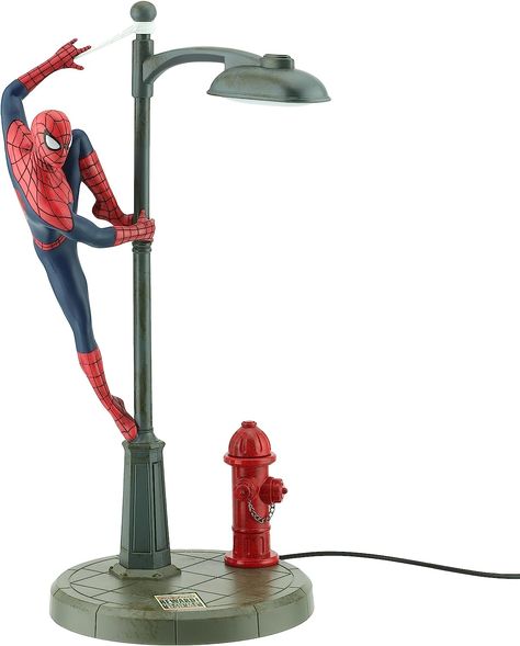 WATCH OUT: Here comes the Spider Man! Featuring Spidey perched on a street lamp and ready to spring into action, this Marvel-ous desk lamp is irresistible for kids and adults of the fandom! SPIDERMAN LAMP: A wonderful piece of Marvel Comics memorabilia, display in your room or office, or use as a night light on your bedside table. The streetlight lights up when the lamp is switched on. Spiderman Lamp, Ultimate Spider Man, Hello Kitty House, Marvel Collectibles, Wonder Woman Logo, Batman Beyond, Man Room, Millennium Falcon, Bedside Lighting