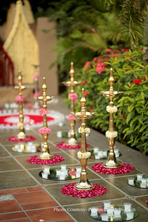 Khushali and Anant, Ahmedabad - WeddingSutra Brass Ganapati Decoration, Brass Decor Wedding, Deepam Decoration Ideas, Uruli Decor Ideas, Festival Decorations Indian, Gruhapravesam Decoration Ideas Usa, Outdoor Wedding Decorations Indian, Pyramid Decoration, Decor Ideas Birthday