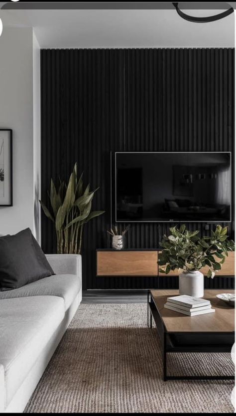 Tv Wall Styling Living Rooms, Dark Feature Wall Living Room Tv, Tv On Dark Wall, Tv On A Black Wall, Black Tv Fireplace Wall, Black Wood Slat Tv Wall, Modern Tv Room Wall, Black Tv Wall Ideas, Black Wall Tv Living Room