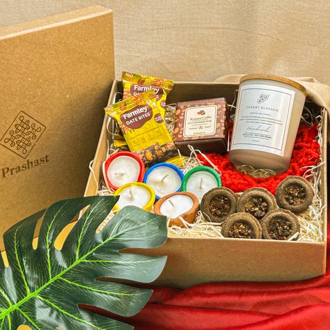 Celebrate Diwali with the perfect blend of tradition and fun! This 100% Handmade Diwali Hamper, packed with delicious Farmley date bites, a cherry blossom scented candle, colorful wax diyas, natural hawan cups, and handmade turmeric soap, is sure to light up your festivities. 🎁✨ Delivering joy globally in just 15 days!

#HandmadeDiwali #FestiveGifts #TraditionalMeetsFun #EcoFriendlyDiwali #DiwaliHampers #GlobalDiwali #FarmleyDelights #CelebrateTradition Diwali Hampers, Diwali Gift Box Photography, Diwali Gifts For Beauty Lovers, Diwali Hamper Box Design, Luxury Chandbalis As Diwali Gift, Intricate Design Sets For Diwali Gift, Diwali Gift Hampers, Cherry Blossom Scent, Turmeric Soap