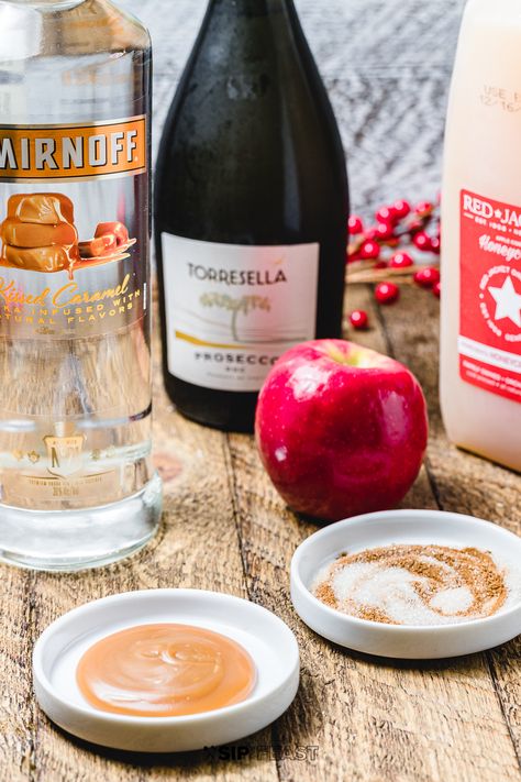 Mimosas are for mornings, but these Caramel Apple Mimosas are really perfect for any time of day. In fact, they are versatile enough to serve for brunch, pre-dinner, and dessert! Prosecco, the tart apple cider, the smooth caramel vodka, and the ridiculously delicious garnish of caramel sauce, cinnamon, and sugar, marry together into one perfectly festive holiday cocktail. #prosecco #sparklingdrink #holidaydrinks #mimosas #cocktails Caramel Vodka Apple Cider, Apple Mimosa, Vodka Apple Cider, Apple Cider Mimosa Recipe, Childhood Candy, Prosecco Drinks, Sip And Feast, Cider Mimosas, Morning Cocktail