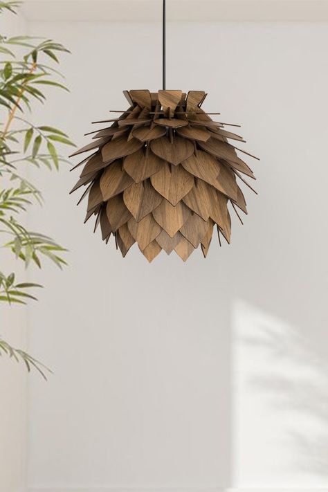 Transform your living space into a cozy haven with our exquisite wooden pinecone lamp. Crafted in a round, walnut hue, this lamp radiates rustic charm, making it the perfect centerpiece for any rustic-inspired decor. Embrace the allure of softly lit surroundings and experience the soothing ambiance it creates. Don't miss out on our bestseller, currently available at a 20% discount. Add a touch of natural elegance to your home today! 🌲✨ Pendant Light Dining Room, Light Dining Room, Lamp Wood, Round Ceiling, Wood Pendant Light, Charm Making, Wood Pendant, Chandelier Lamp, Ceiling Lighting