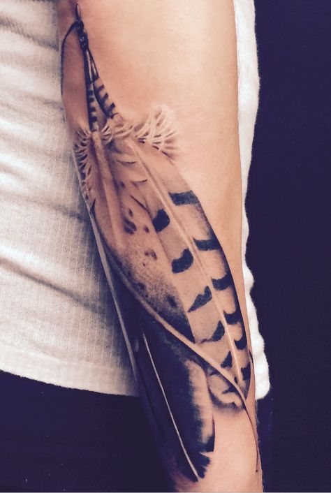 Feather Tattoo Sleeve For Women, Feather Band Tattoo, Indian Feather Tattoos Men, Forearm Feather Tattoo, Mens Feather Tattoo, Native American Hawk Tattoo, Men Feather Tattoo, Pheasant Feather Tattoo, Raven Feather Tattoo