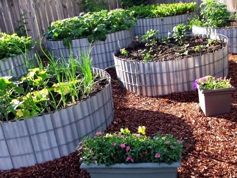 Two Men and a Little Farm: ROUND RAISED BEDS, INSPIRATION THURSDAY Easy Raised Garden Bed, Plantarea Legumelor, Tire Garden, Raised Bed Garden Design, Raised Vegetable Gardens, Raised Flower Beds, Garden Plots, Raised Garden Beds Diy, Veg Garden