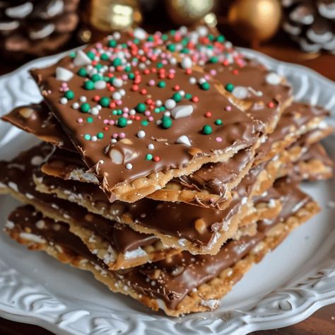 Christmas Crack Saltine Cracker Toffee is the perfect sweet and salty holiday treat! Make this easy recipe today. Try it now! Saltine Cracker Candy, Christmas Bark Recipes, Saltine Cracker Toffee, Easy Toffee, Saltine Cracker, Bark Recipes, Christmas Bark, Saltine Toffee, Cracker Candy