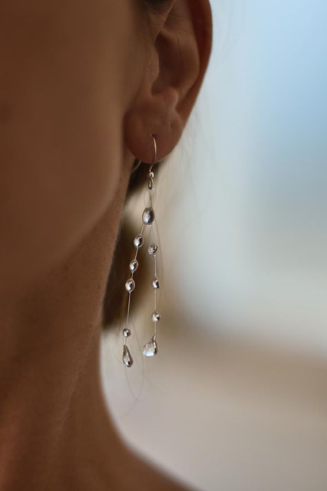 Water drop like earrings made of UV resin on monofilament line with stainless steel hooks.   Perfect for everyday wear or formal wear as they look like crystals. *Important* Keep in mind that every earring is made to order and there are no two same earrings. Every drop is unique and small changes are possible when it is handmade.  I always try my best to make it as similar as possible to the one you ordered.  Thank you! Water Droplet Earrings, Minimalist Dangle Earrings, Rain Drop Jewelry, Resin Drop Earrings, Water Drop Jewelry, Waterdrop Earrings, Raindrop Earrings, Water Jewelry, Water Drop Necklace