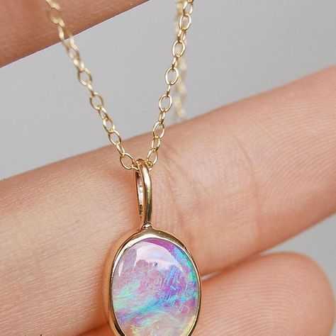 ELE GOODS | ethical jewelry on Instagram: "Bringing dreams to life! ✨ I crafted this stunning pendant for a lovely client who asked me to make a simple necklace. Mesmerising Australian crystal opal, surrounded by solid gold. Its charm lies in its color shift – from calming blues to lush greens and regal purples 💙💚💜 This pendant blends simplicity with luxury, exuding elegance in every detail. 💫 It's a hidden treasure of opulent beauty ✨" Ethical Jewelry, Opal Crystal, Simple Necklace, Lush Green, Solid Gold, Opal, Bring It On, Crystals, Purple