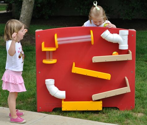 Watch as the ball travels through tubes, pipes and chutes. A Tracking Panel on your outdoor preschool playground allows children to observe and demonstrate directional words. They can visually track the object as it goes fast, faster and slower. When children use a variety of objects and compare the speed of travel, they learn about physical properties and cause and effect.  The Tracking Panel is also available in cedar for your natural playground. Backyard Play Equipment, Plastic Playground, Playground Accessories, Preschool Playground, Natural Playground, Outdoor Classroom, Play Structure, Backyard Playground, Backyard Play