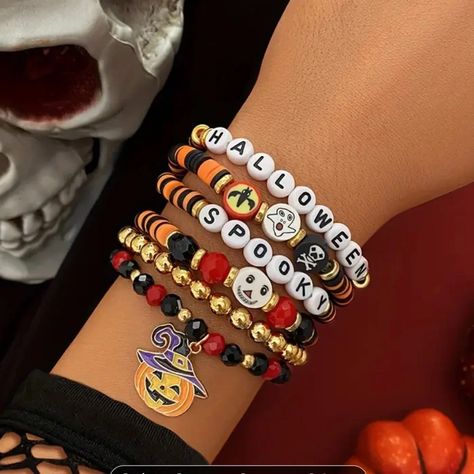 In This Package You Will Receive 5 Stretchy, Halloween Beaded Bracelets. Within The 5 Bracelets At Least One Will Have Words, And/Or A Charm, And/Or Gold Beads. The Set Of 5 Will Match Color/Theme. Please Message Me Privately In A Bundle If You’d Like Anything Specific Or If You Do Not Want Any Thing Specifically (Such As: “Not The One That Spells Out Devil” Or “Anything But Skulls”). Things Like That. Although There Are No Actual “Tags” This Item Is Handmaid And Brand New. Bracelet Stand, Bracelet Inspo, Halloween Bracelet, Boo Basket, Halloween Beads, Beads Bracelet Design, Bracelets Diy, Bracelet Design, Bracelet Ideas