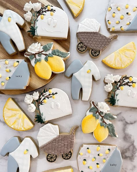 Renee Terry on Instagram: “The sweetest little lemon baby shower set ever! The idea here was to keep lemons as the main attraction with splashes of dusty blue thrown…” Main Squeeze Gender Reveal, Lemons Baby Shower Ideas, Lemon Squeeze Baby Shower Theme, Lemon Blue Baby Shower Theme, Our Main Squeeze Baby Shower Theme, Mommy’s Main Squeeze, Summer Baby Shower Cookies, Little Lemon Baby Shower Theme, Italy Theme Baby Shower Ideas