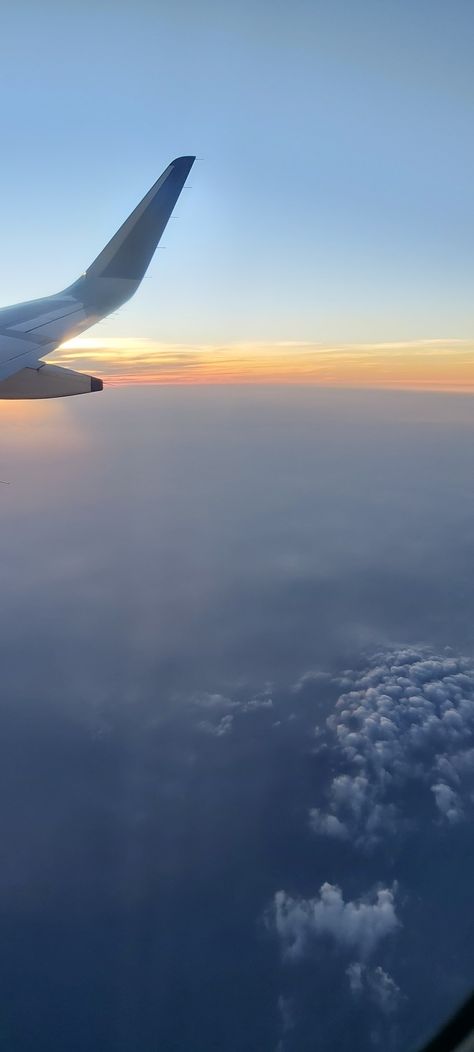 The view from inside a flight's window side seat. It shows clouds and the sunset. Indigo Flight Window View, Flight Window View, Amma Quotes, Flight Window, Flight View, Airplane Window View, Window Siding, Airplane Window, Night Flight