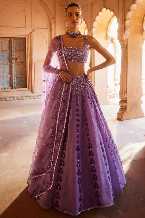 Featuring a purple lehenga in organza base with thread, sequins and mirror work, including hand block print. It is paired with a matching net embellished blouse and a dupatta. . #perniaspopupshop #whatiworewastrending #ppuslove #lehengaset #indianattire #ethnic Lehenga Belt, Indian Wedding Dress Traditional, Lavender Lehenga, Cultural Clothes, Purple Lehenga, Ethereal Elegance, Organza Lehenga, Vacuum Storage, Indian Wedding Wear