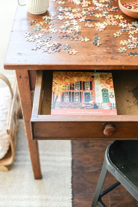 How to Create a Cozy Puzzle Table Corner Puzzle Tables Ideas, Chess Board On Coffee Table, Puzzle Table Ideas Small Spaces, Puzzle Table In Living Room, Puzzle Room Ideas, Puzzle Table Ideas, Diy Puzzle Table, Small Game Table, Puzzle Corner