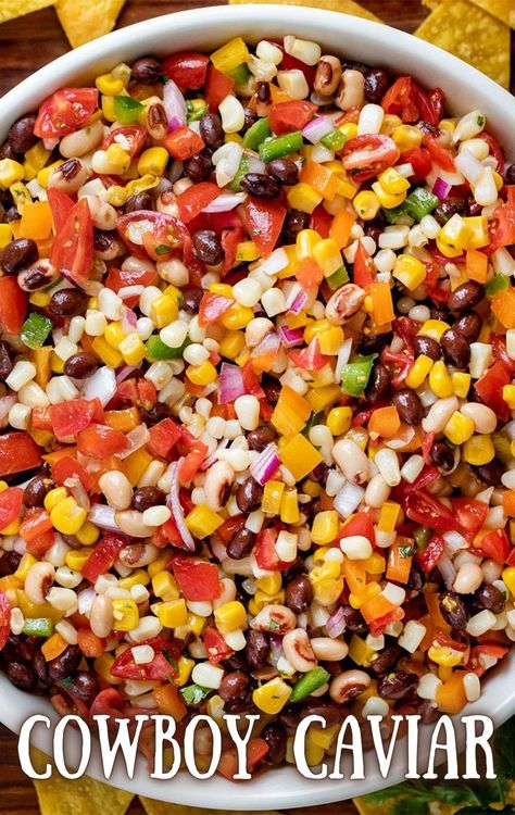 Overhead image of a large white bowl filled with fresh diced vegetables, including various peppers, white corn, yellow corn, black eyed peas, black beans, red onion, and tomatoes. Italian Vinaigrette Dressing, Texas Caviar Recipe, Italian Vinaigrette, Caviar Recipes, Vegetable Plate, Cowboy Caviar, Chicken Thigh Recipes Crockpot, Lake Food Ideas, Summer Corn Salad