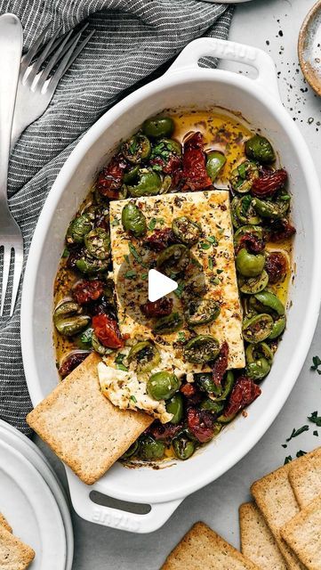 Lisa Bryan on Instagram: "This Mediterranean baked feta is officially my signature appetizer for dinner parties! I’ve made this countless times for friends and family in the last couple of months, and it always gets devoured fast 🤣

🔹 Comment “feta” below and I’ll send the recipe straight to you! I can’t wait to see how yours turns out. 

📷: @gaylemcleod 

#bakedfeta #mediterraneandiet #mediterraneanrecipes #appetizers #olives #sundriedtomatoes #mediterraneanfood #fetacheese #bakedfeta #easyappetizers #glutenfree #glutenfreefood" Mediterranean Appetizers Appetizer Ideas, Appetizer For Dinner, Olive Dip, Mediterranean Recipes Healthy, Dinner Party Appetizers, Baked Feta, Hot Appetizers, Bread Dip, Healthy Plant Based Recipes