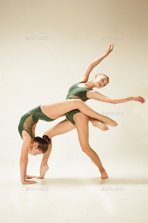 The two modern ballet dancers by master1305 on PhotoDune. The two modern ballet dancers dancing on gray studio background Modern Dans, Modern Ballet, Dancing Poses, Yoga Challenge Poses, Acro Dance, Dance Picture Poses, Dance Photo Shoot, Dancer Photography, Dance Photography Poses