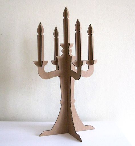 Candelabro moderno de cartón - Modern Cardboard Candelabra http://www.etsy.com/listing/76503342/modern-cardboard-candelabra-centerpiece?ref=mh_link&mh_hub=home&mh_eid=1066252007&mh_section=clusters&mh_cid=eco-friendly-decor Medieval Props, Halloween Candelabra, Cardboard Chandelier, Paper Chandelier, Centerpiece Party, Medieval Crafts, Candelabra Centerpiece, Medieval Party, Cardboard Design