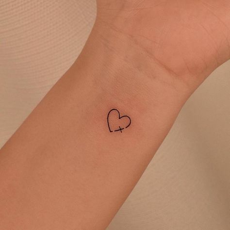 Cross Small Tattoo For Women, Minimalist Tattoo Faith, Cute Small Tattoos Wrist, Cross In Heart Tattoo, Small Wrist Tattoos For Women Christian, Tattoo Ideas Small Christian, Small Tattoos About God, Minimalist Tattoo About God, Mini Tattoos On Hand