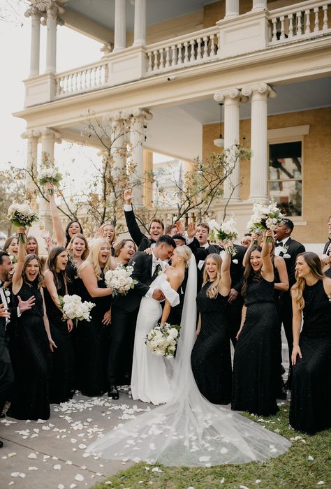 Bride And Groom Pictures With Bridal Party, Black Bridesmaids Gray Groomsmen, Guests Wear All Black Wedding, All Black Wedding Guest Photos, Spring Wedding With Black Bridesmaid Dresses, Chanel Wedding Aesthetic, Wedding Where All Guests Wear Black, All Black Bridal Party Dresses, All Black Wedding Guests Photos