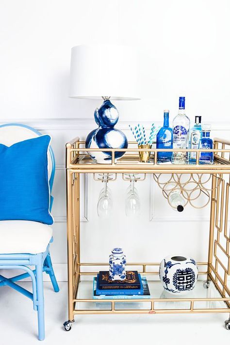 STYLECASTER | Bar Cart Ideas | bar cart styling | bar cart decor | bar cart essentials | bar car DIY | bar cart styling ideas | bar cart styling apartments | bar cart decor ideas Blue Bar Cart, Diy Bar Cart, Gold Bar Cart, Bar Cart Styling, Blue Bar, White Bar, Bar Cart Decor, Contemporary House Design, Décor Diy