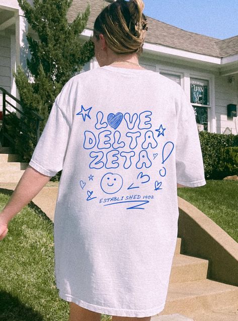 Soft, cute, and trendy, this Delta Zeta sorority t-shirt will quickly become your go-to cozy shirt! Use the drop down to specify preference between white, ivory, violet, island reef, chambray, orchid and blossom.LISTING IS FOR DELTA ZETA. Please be sure you are ordering for your correct Sorority.We print on high quality, soft, & heavyweight materials, sustainably made and printed in the US.♥ SIZING ♥Unisex Sizing-For a more feminine, fitted look we recommend getting your size.For a more oversize Zeta Tau Alpha Shirts, Alpha Phi Sorority, Kappa Delta Sorority, Alpha Epsilon Phi, Sorority Shirt Designs, Big Little Shirts, Delta Sorority, Alpha Sigma Tau, Delta Phi Epsilon