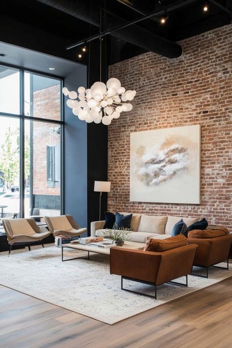 An industrial-chic setting with a painted exposed brick accent wall in soft neutral shades, balanced by sleek contemporary furniture. Accent Wall Industrial, Exposed Brick Walls Living Room, Living Room Accent Wall, Living Room Decor Tips, Room Decor Tips, Gold Framed Mirror, Room Accent Wall, Accent Wall Ideas, Accent Walls In Living Room